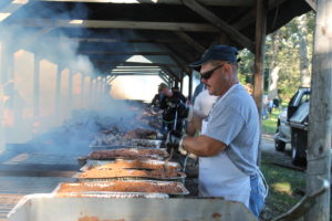 Mike Stelmach, who works at Mount Saint Joseph, stirs the chopped barbecue that will be used in sandwiches.