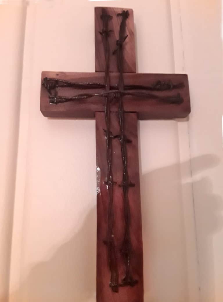 Sister Angela Fitzpatrick shared the story from this cross from her days as an Ursuline Sister of Paola: “This crucifix was a gift from Father Aaron, OSB, a former chaplain at our convent in Paola, Kansas. He made it from wood from our barn and barbed wire fencing. He sent it to me for my 50th Jubilee from his monastery in Atchison, Kansas. It holds special memories since it is handmade, and the materials come from our former property in Paola.”