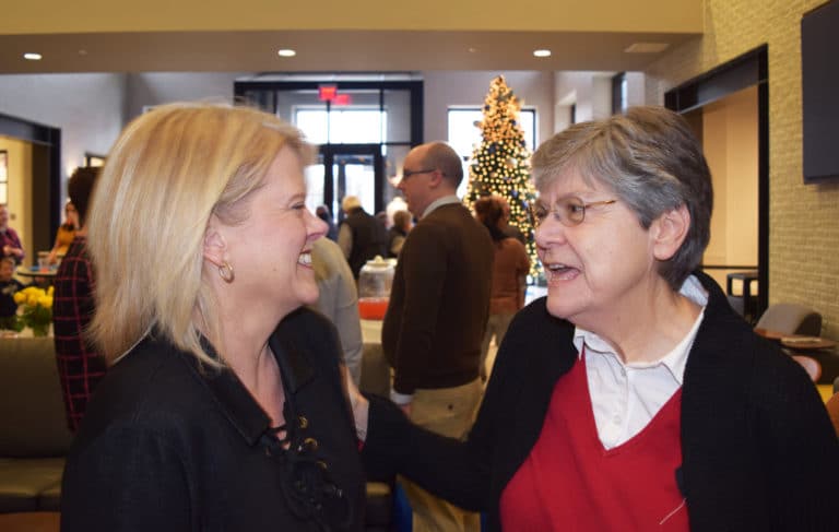 Amy Carpenter, left, administrative assistant for Human Resources, shares a laugh with Sister Cheryl.
