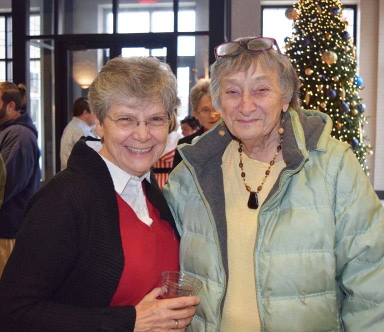 Beverly McCandless, longtime Brescia Bookstore manager, wishes Sister Cheryl well.