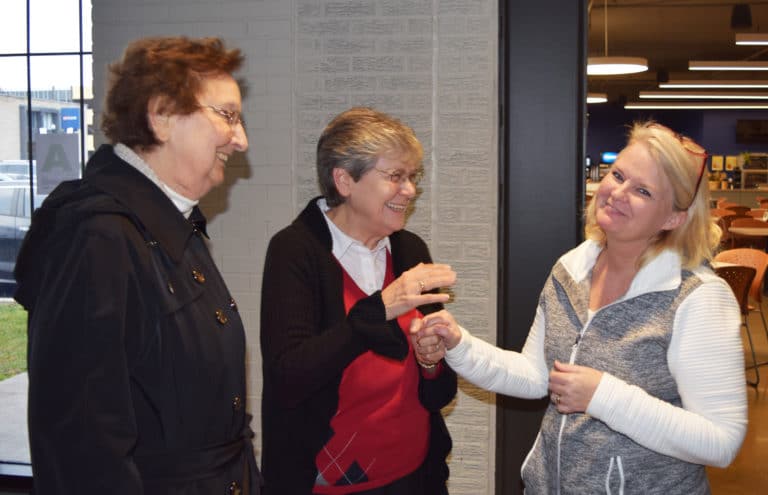 Sister Susan Mary Mudd, left, administration assistant for the School of Business, and Julie Johnson, associate professor of management and chairwoman of the School of Business, find plenty to laugh about.