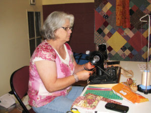 Dana Hughes, of Mayfield, Ky., works on her Twisted Bargello quilt during the Sit and Sew on Sept. 17.