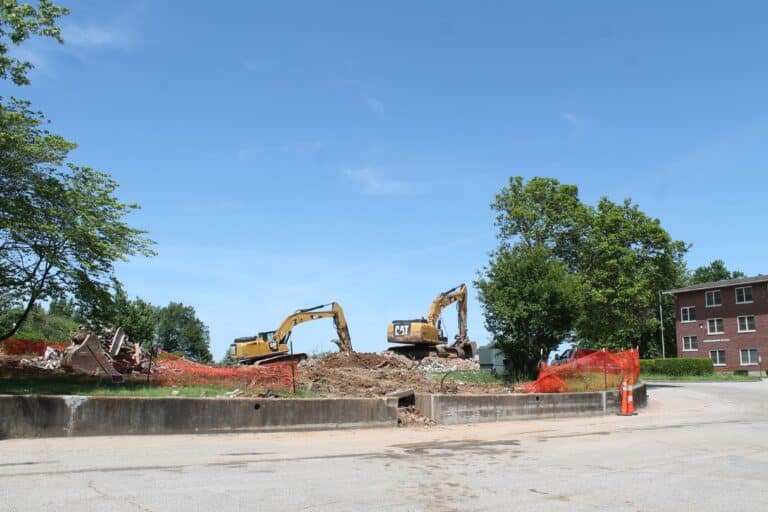 Construction equipment can be seen on the site.