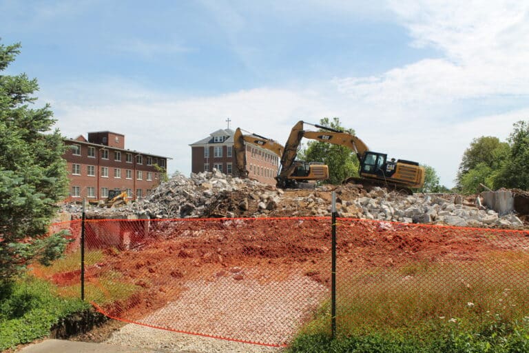 The Lourdes building and St. Angela Hall can be seen in the background where the deconstruction is taking place.