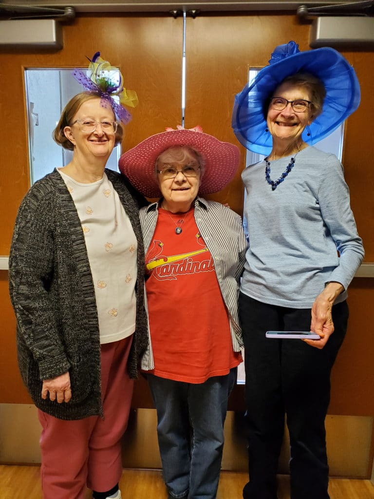 As the graduation party ended, it gave way to a Kentucky Derby party. From left, Ursuline Sisters Rebecca White and Cecelia Joseph Olinger are joined by Sister Jeannette Fennewald, a School Sister of Notre Dame, to display their derby hats.