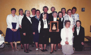 The many Ursuline Sisters who served in Farmington, N.M., gather in this 1991 photo. Back Row – Sisters Sheila Anne Smith, Michael Ann Monaghan, Sara Marie Gomez, Frances Louise Johnson, Mary Edgar Warren, Marie Montgomery and Elaine Burke; front Row – Sisters Margaret Ann Wathen, Lisa Marie Cecil, Charles Marie Coyle, Mary Evelyn Duvall, Marie Brenda Vowels and Mary Angela Matthews; kneeling – Sisters Cecilia Joseph Olinger and Robert Ann Wheatley