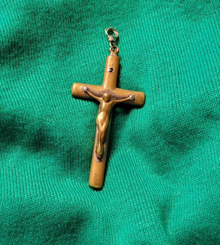 Sister Mary Matthias Ward shared this special cross: “Father Volk gave this cross to Mrs. Powers, the mother of Father Richard Powers. About three or four years ago Father Richard came to visit me at the Mount Saint Joseph Conference and Retreat Center. He showed me the cross told me the story and said, ‘I feel it is time for me to pass this cross to you.’ I carry it in my left slack pocket all the time. Since I have had it, Jesus came off the cross. I had a jeweler to put it together, and I carry it in a case in my pocket. I am very conscious that I carry something very sacred and often sit just holding it and praying for someone’s healing.”