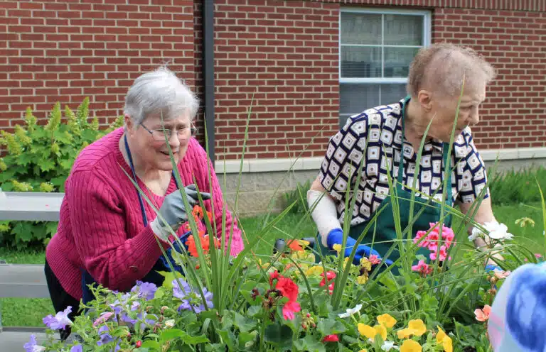 Sister Karla Marie Kaelin and Sister Marie Carol Cecil look over the flowers to make sure everything is done. Sister Karla Marie Kaelin and Sister Marie Carol Cecil look over the flowers to make sure everything is done.