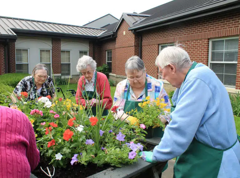 Left to right, Sisters Lois Lindle, Mary Gerald Payne, Joyce Cecil and Grace Simpson find places for the remaining flowers. Left to right, Sisters Lois Lindle, Mary Gerald Payne, Joyce Cecil and Grace Simpson find places for the remaining flowers.