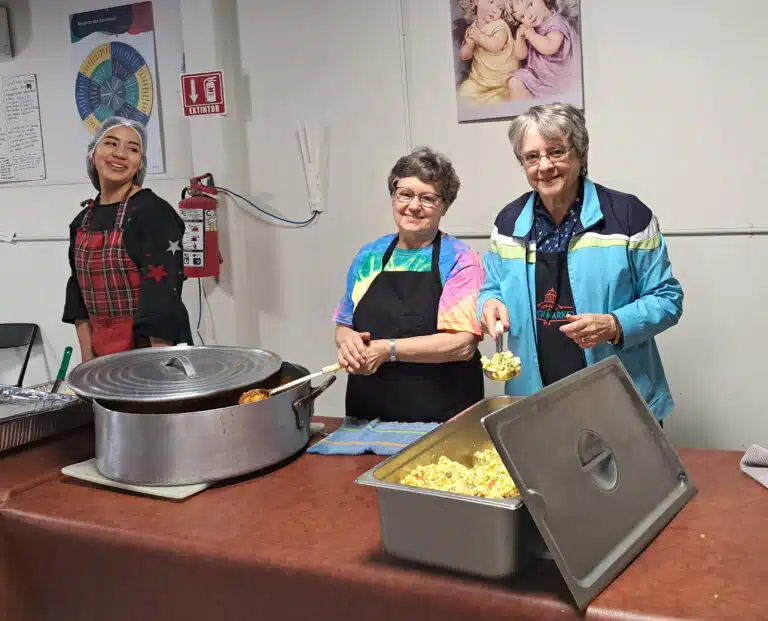 Sister Jacinta Powers, right, and Sister Donna Marie Gribschaw prepare to serve food during one of two meals provided each day. Sister Jacinta Powers, right, and Sister Donna Marie Gribschaw prepare to serve food during one of two meals provided each day.