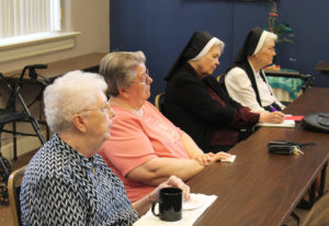 From left, Ursuline Sisters Mary Agnes VonderHaar, Rose Jean Powers, Rose Marita O’Bryan and Joseph Angela Boone listen to Sister Vivian say, “You have to open yourself to grief and what it’s opening you to.”