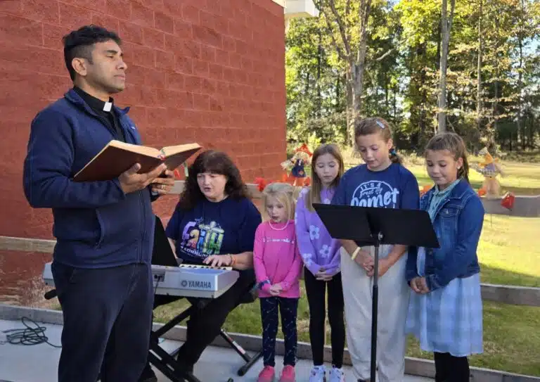 Father Suneesh Mathew, who became pastor of St. Paul in June 2024, sings with the children’s choir at the dedication. Father Suneesh was previously the pastor at Precious Blood Parish in Owensboro. Father Suneesh Mathew, who became pastor of St. Paul in June 2024, sings with the children’s choir at the dedication. Father Suneesh was previously the pastor at Precious Blood Parish in Owensboro.