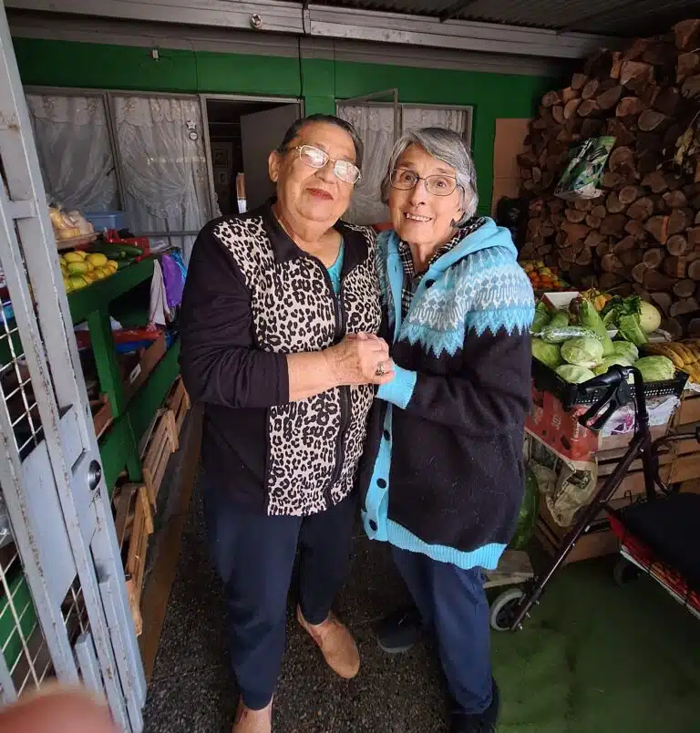 Sister Mimi visits with Adriana, a fruit vendor who is friends with Sister Ruth Gehres. Sister Mimi visits with Adriana, a fruit vendor who is friends with Sister Ruth Gehres.