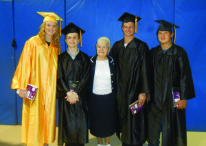 Sister C.J., center, presents bibles to Catholic graduates of Van Buren High School at the Baccalaureate service on May 8, 2013. The bibles are provided by St. George Church in Van Buren, where Sister C.J. ministers. Pictured from left are Hattie Dazey, Alex Strenfel, Sister C.J., Eric Dazey and Zach Dazey.