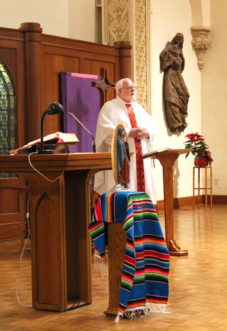 Father Ray Goetz gives the homily during Mass.