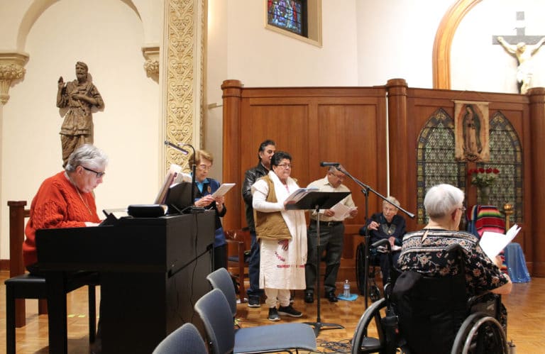 Sister Ruth Gehres plays the keyboard as the choir sings the offertory: “O Maria, Madre Mia” (O Mary my Mother).