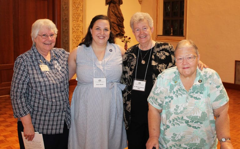 New Associate Renee Schultz, second from left, who is from Prairie Village, Kan., poses with Sister Pat Lynch, left, Sister Kathleen Dueber, right, and Sister Michele Morek. Sisters Pat and Kathleen are former Ursuline Sisters of Paola, Kan., and Sister Michele now ministers in Kansas City, Mo.
