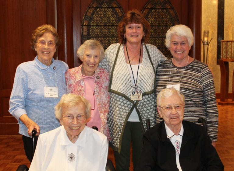 The previous and current directors or coordinators of the Ursuline Associate program gathered for a photo after the commitment ceremony. Seated are Sister Fran Wilhelm, left, who served from 1983-92, and Sister Marie Bosco Wathen, who served from 1996-2002. Standing, from left, are Sister Elaine Burke (1996-98), Sister Marietta Wethington (2004-2011, 2013-14), current Coordinator Doreen Abbott and Associate Marian Bennett (2004-2018). The only living former director not present was Associate Cecilia McEldowney. Sister Mary Lois Speaks (1992-96) and Sister Marita Greenwell (1996-2002) are both deceased.