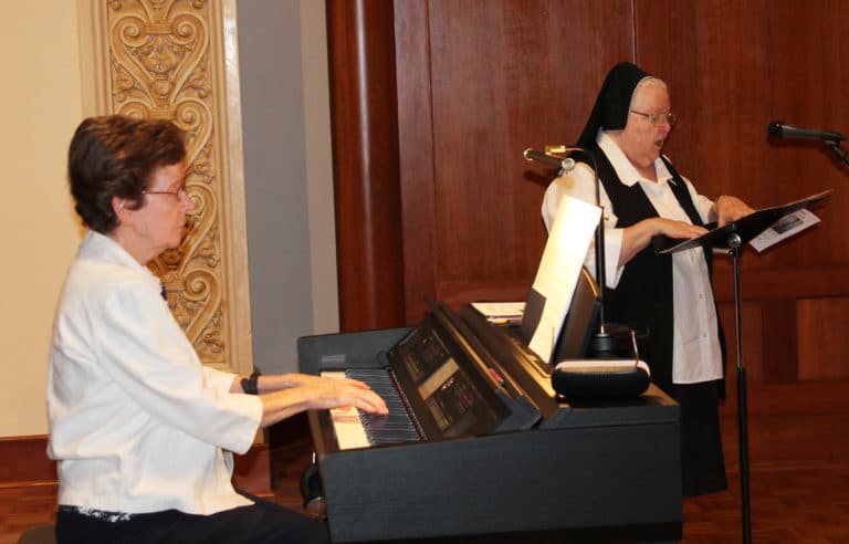 The day concluded with Mass, celebrated by Father Joe Merkt. Sister Mary Henning, left, and Sister Catherine Marie Lauterwasser were the musicians for Mass.