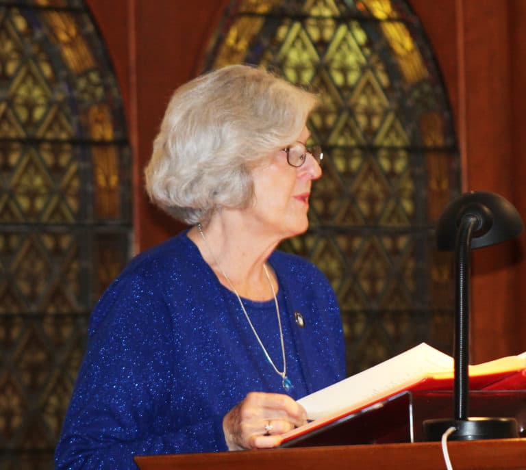 Associate Pauline Goebel proclaimed the first reading.