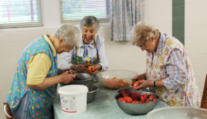 Who knew cutting up peaches could be so fun? Just ask Sister Marcella Schrant, left, Sister Marietta Wethington, center, and Sister Mary Sheila Higdon.