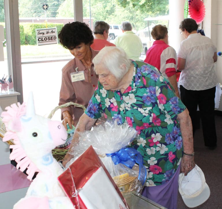 Sister Catherine Kaufman, right, and Janie Walther, an employee of the Mount Saint Joseph Conference and Retreat Center, admire some of the handmaid items in the shop.