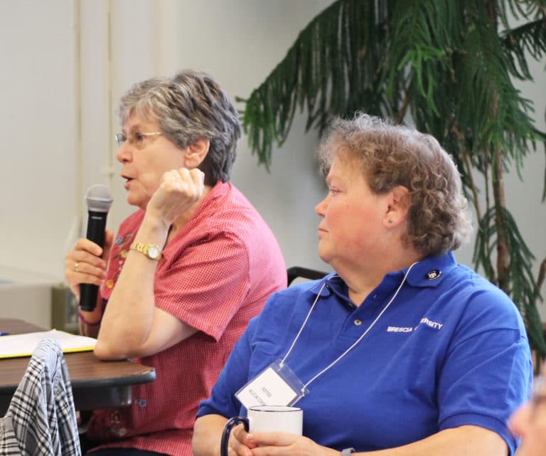 Ursuline Sister Cheryl Clemons, left, discusses the challenges in knowing all the sisters well when they don’t all live together, as Sister Alicia Coomes listens.