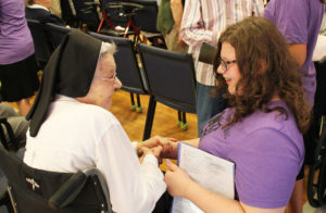 The highlight every year is that after the short concert, all the campers visit with the sisters. Here, Sister Pauletta McCarty shares a smile with this young lady.