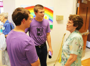 Sister Elaine Burke, who worked Music at Maple Mount for several years, talks to these two young men after the concert.