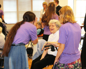 Sister Catherine Barber gets a big laugh talking to these two young musicians.