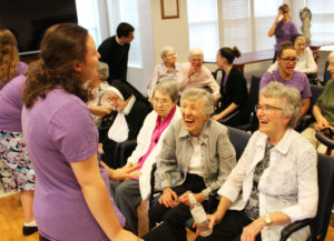 Sister Ann Patrice Cecil, right, Sister Marietta Wethington, center, and Sister Clarence Marie Luckett get a kick out of this camp member.
