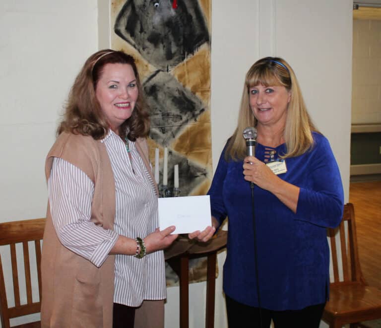 Elaine, left, accepts a gift card from Dee Dee Jackson, director of Human Resources, during lunch.