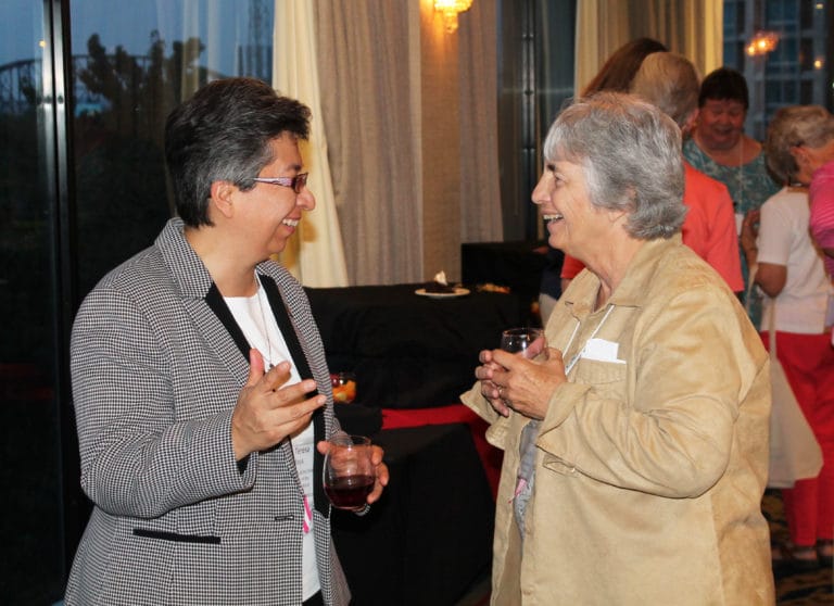 Sister Teresa Maya, left, the keynote speaker for the Convocation, shares a laugh with Ursuline Sister of Toledo Carol Reamer, who was co-chairwoman for the Convocation.