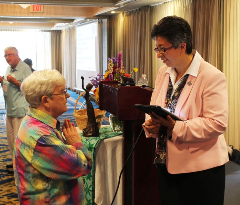 Ursuline Sister of Mount Saint Joseph Cecelia Joseph Olinger, left, talks with keynote speaker Sister Teresa Maya during a break on July 26. Sister Teresa played a song later to remind everyone that “Jesus is a verb, not a noun.” She said it’s essential that the Ursuline charism always points toward Jesus.