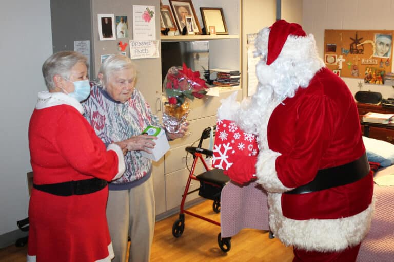 Sister Catherine Kaufman is running out of hands to hold all of her presents from Mr. and Mrs. Claus.