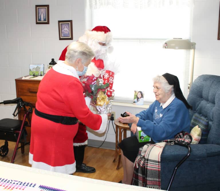 Sister Michael Ann Monaghan is excited about her unexpected presents from Santa.