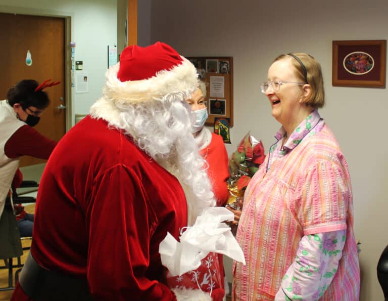 Sister Rebecca White missed Santa last year, so she made sure to be ready for his visit this time.