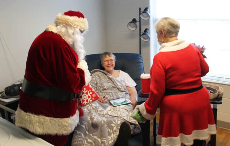 Sister Melissa Tipmore is happy to see Santa and Mrs. Claus. This is her first year in the Villa during Christmastime.