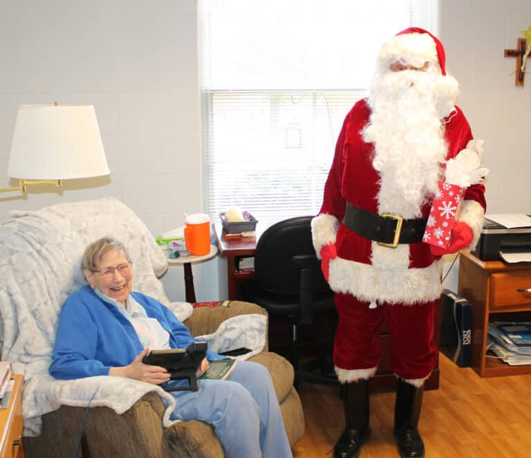 Santa said something funny to get a big laugh out of Sister Susanne Bauer.