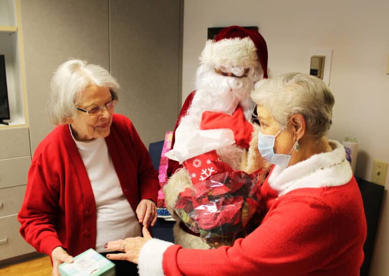 Mrs. Claus (Elaine Wood) tells Sister Catherine Barber that she hasn’t changed a bit in the many years since she first met her.