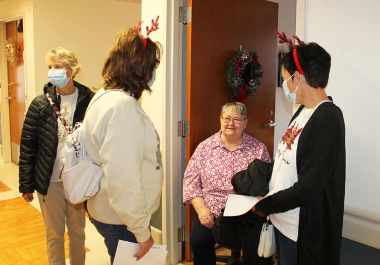 Louanne Seibert, center, and Patti Bartley, right, who both serve with the Marriage Tribunal, talk with Sister Joyce Marie Cecil, as Mary Hall, Human Resources director, looks on. Louanne Seibert, center, and Patti Bartley, right, who both serve with the Marriage Tribunal, talk with Sister Joyce Marie Cecil, as Mary Hall, Human Resources director, looks on.