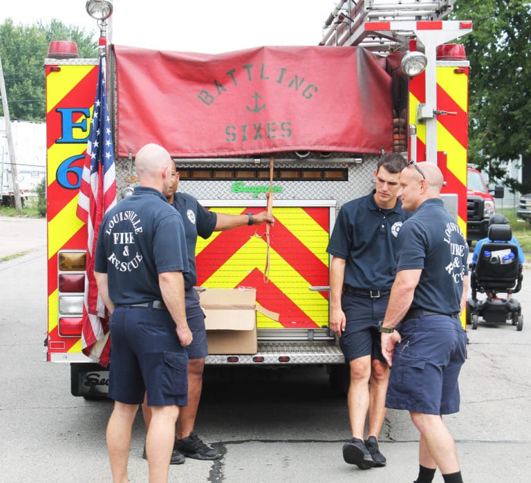 Members of Louisville Fire and Rescue helped stop traffic for the block party.