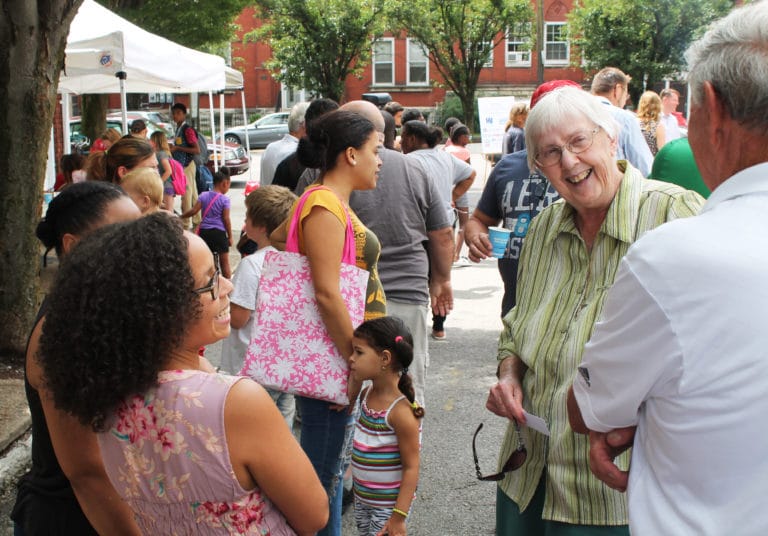 Sister Grace Simpson, right, runs into some old friends who were waiting in the lunch line.