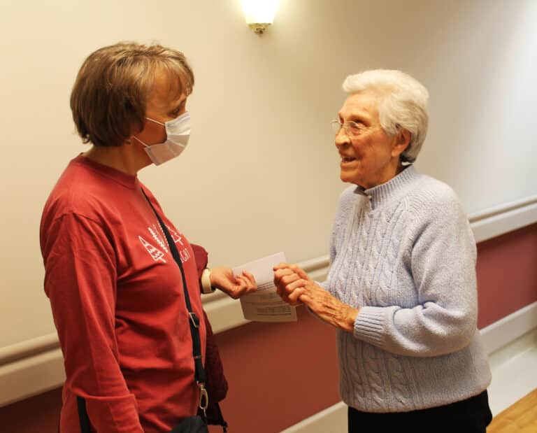 Sister Elaine Burke, right, talks with Martha Hagan, vice chancellor and administrative assistant to the bishop. Sister Elaine Burke, right, talks with Martha Hagan, vice chancellor and administrative assistant to the bishop.