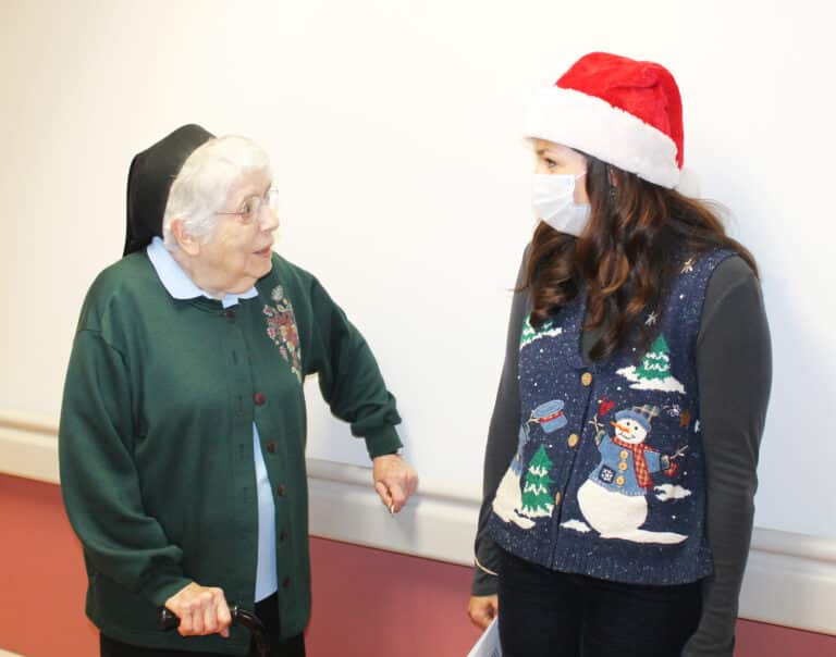 Sister Michael Ann Monaghan, left, talks with Rachel Hall, director of Communications. Sister Michael Ann Monaghan, left, talks with Rachel Hall, director of Communications.