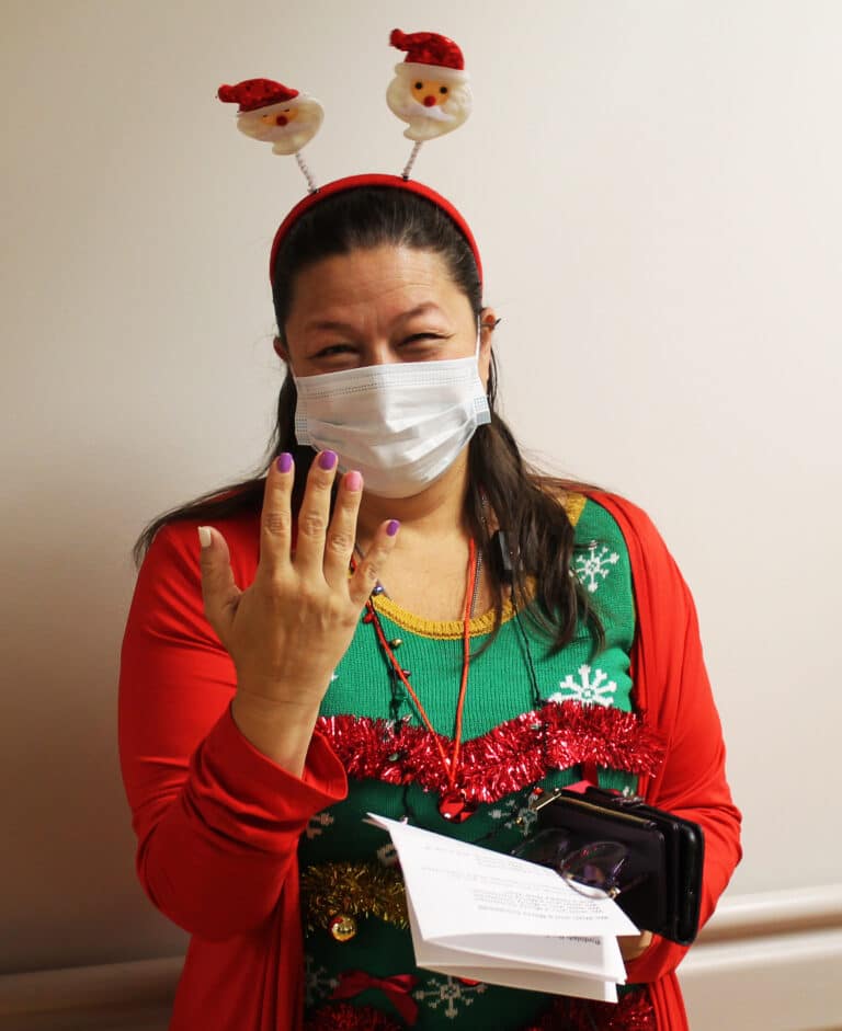 Susan Montalvo-Gesser, director of Catholic Charities, displays her fingernails painted for the Advent candles. Susan Montalvo-Gesser, director of Catholic Charities, displays her fingernails painted for the Advent candles.