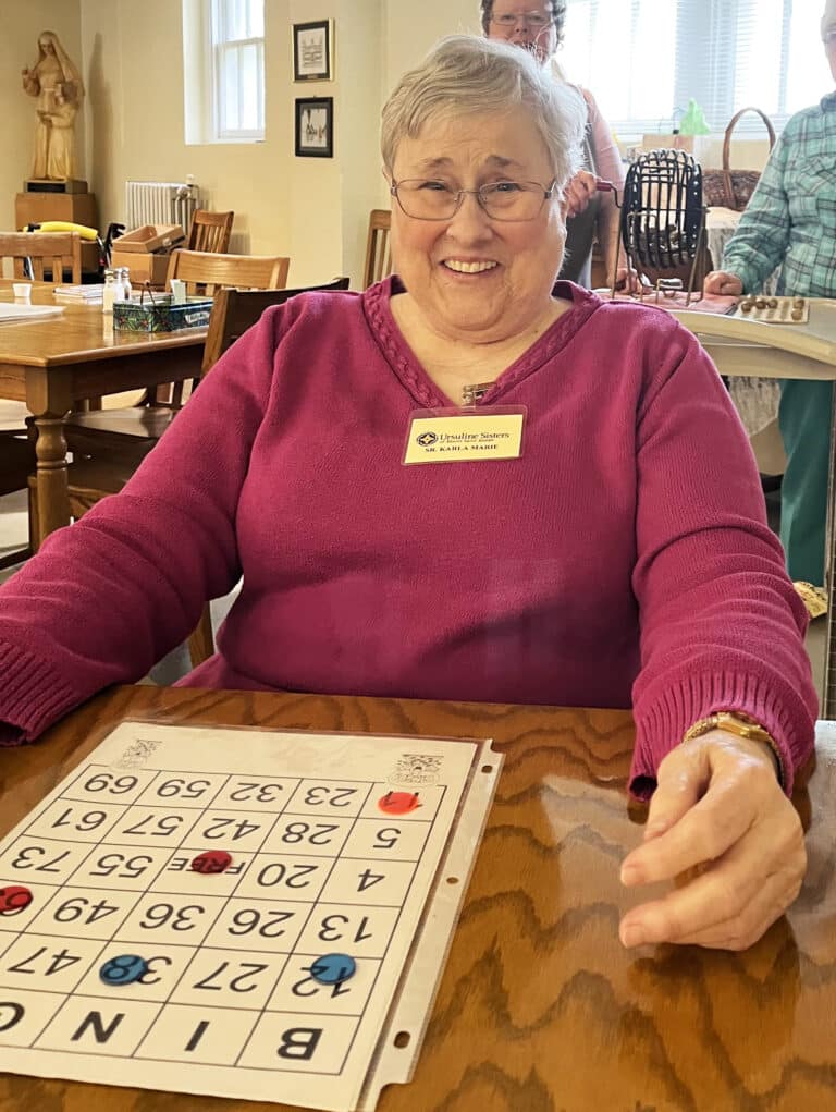 Sister Karla Kaelin shares a laugh during her bingo game. She is celebrating her 60th year as an Ursuline this year.