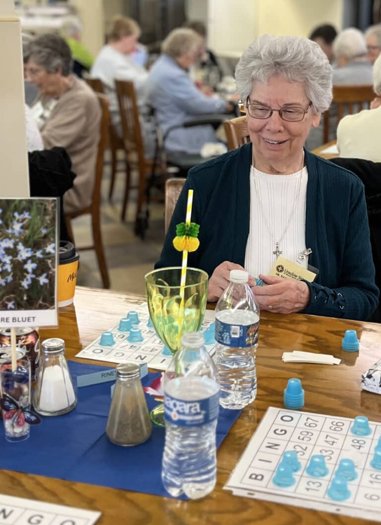 Sister Nancy Murphy looks close to victory in her bingo game. Sister Nancy is on the Council of Religious Steering Committee.