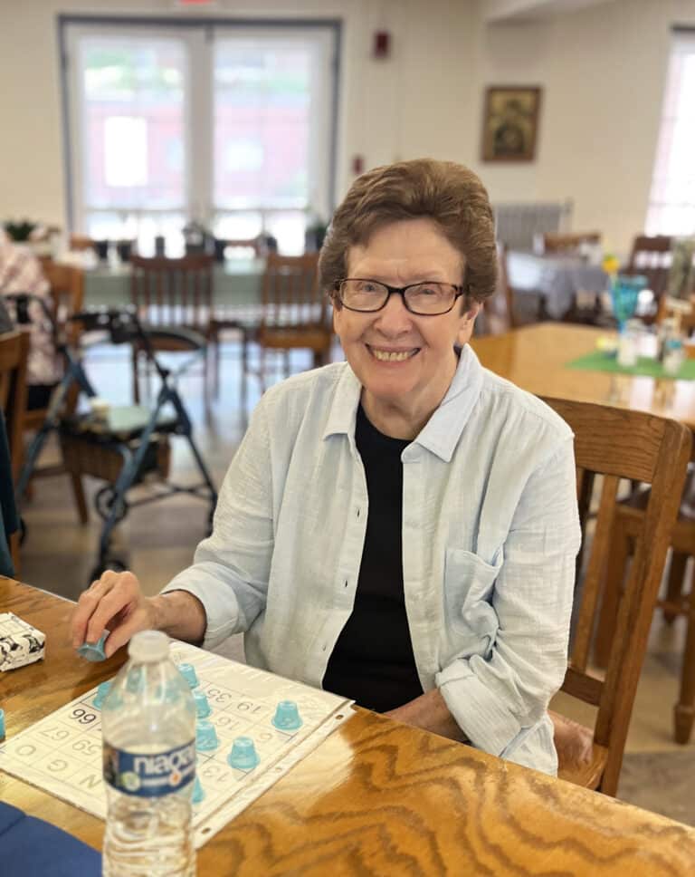 Sister Mary Henning is all smiles in the dining room.