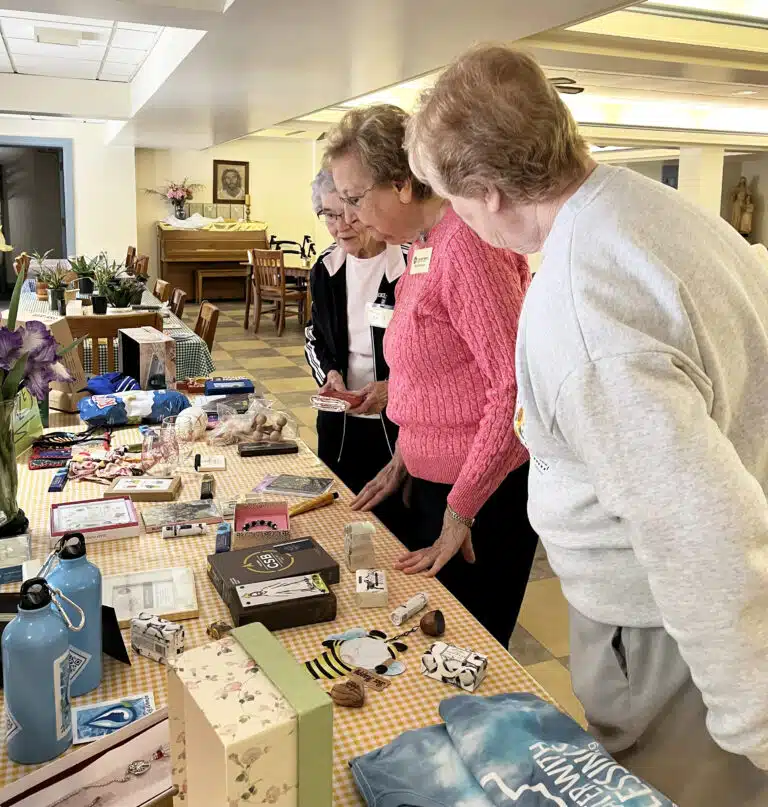 From the far end, Sister Ann Patrice Cecil, Sister Susan Mary Mudd and Sister Helena Fischer peruse the gift table for winning bingo. From the far end, Sister Ann Patrice Cecil, Sister Susan Mary Mudd and Sister Helena Fischer peruse the gift table for winning bingo.
